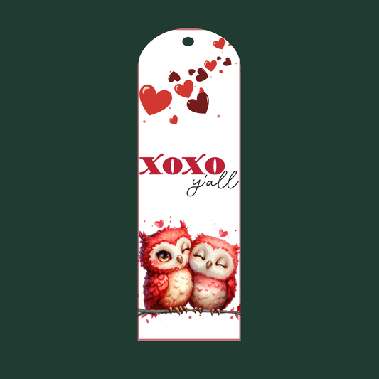 "Aluminum Valentine’s bookmark with two red owls cuddling, hearts, and the phrase 'XOXO y’all' in playful red and script text."