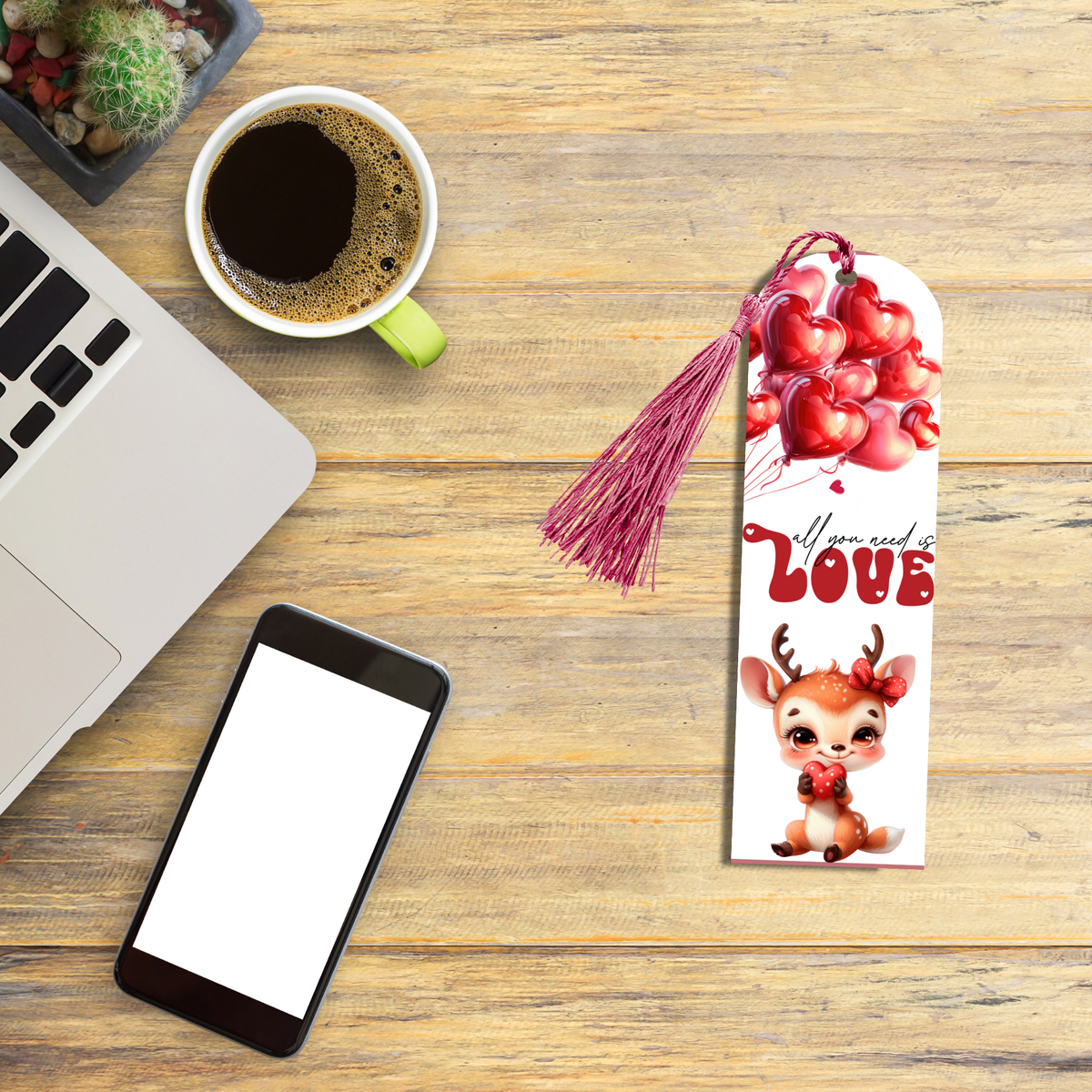 "Aluminum bookmark with red heart balloons, 'All you need is LOVE' text, and cute cartoon deer holding a heart, with a blue tassel."