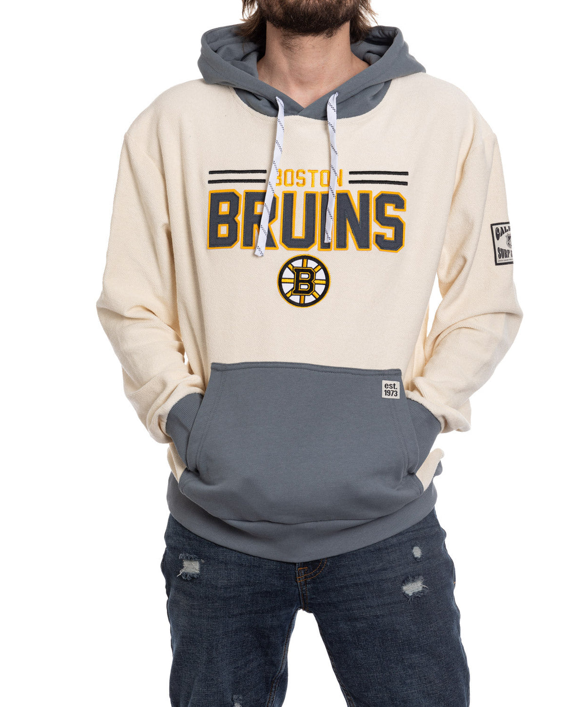 Person wearing a Boston Bruins hoodie with a white and gray color scheme.
