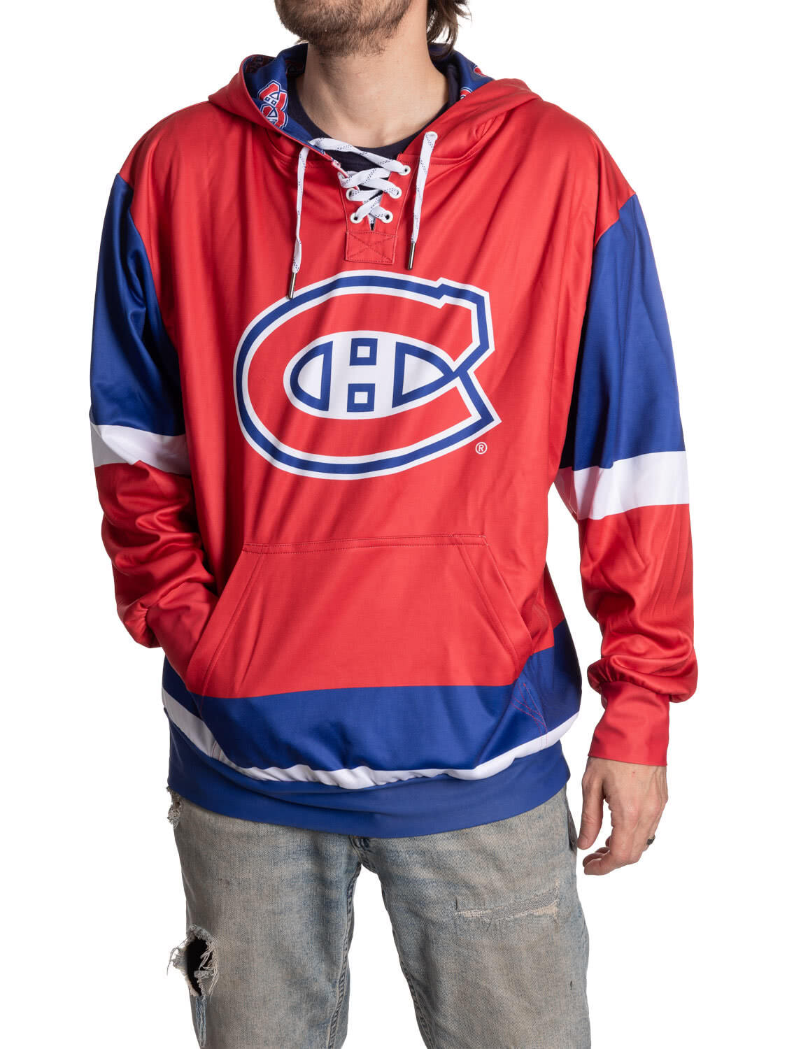 Person wearing a red and blue hoodie with a logo on a white background