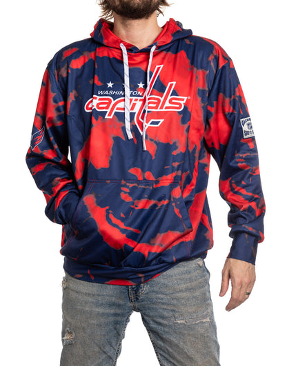 Person wearing a Washington Capitals tie-dye hoodie on a white background