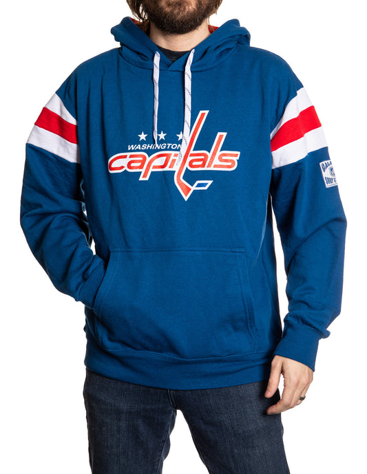 Person wearing a blue hoodie with Washington Capitals logo