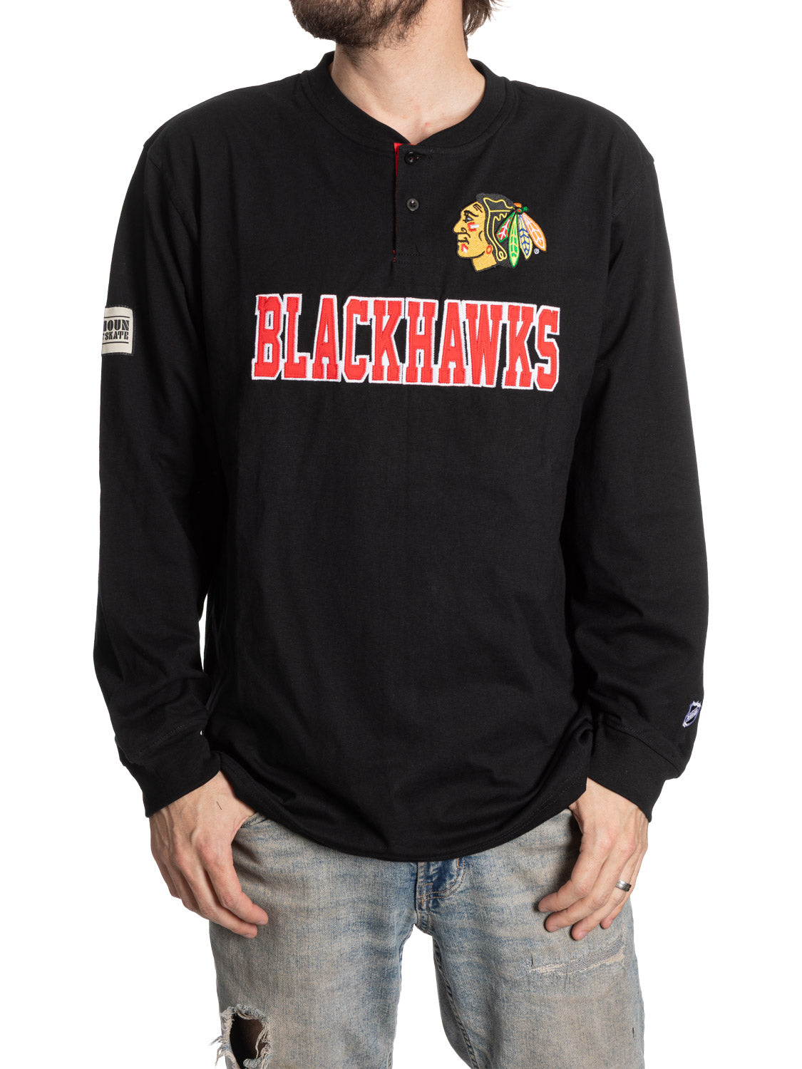 Black long-sleeve shirt with Blackhawks logo and text on a white background