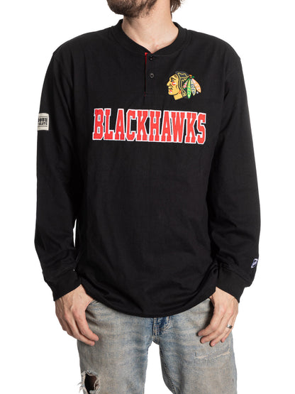 Black long-sleeve shirt with Blackhawks logo and text on a white background