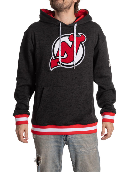 Black hoodie with a red and white logo worn by a person on a white background