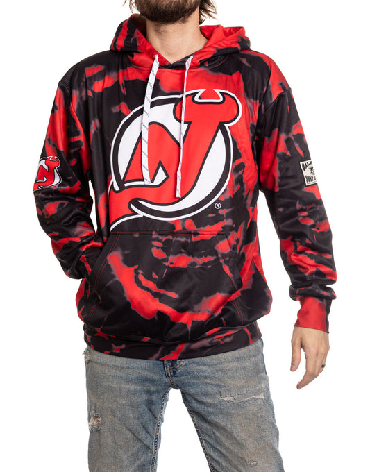 Person wearing a red and black hoodie with a logo on a white background
