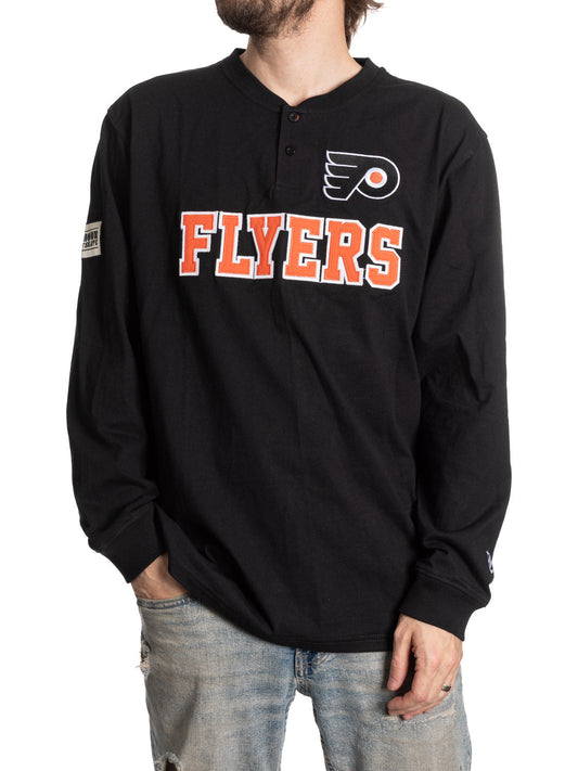Black long-sleeve shirt with 'Flyers' text and logo worn by a person on a white background