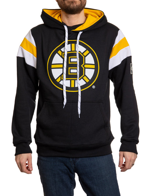 Black hoodie with yellow and white accents featuring a logo, worn by a person on a white background