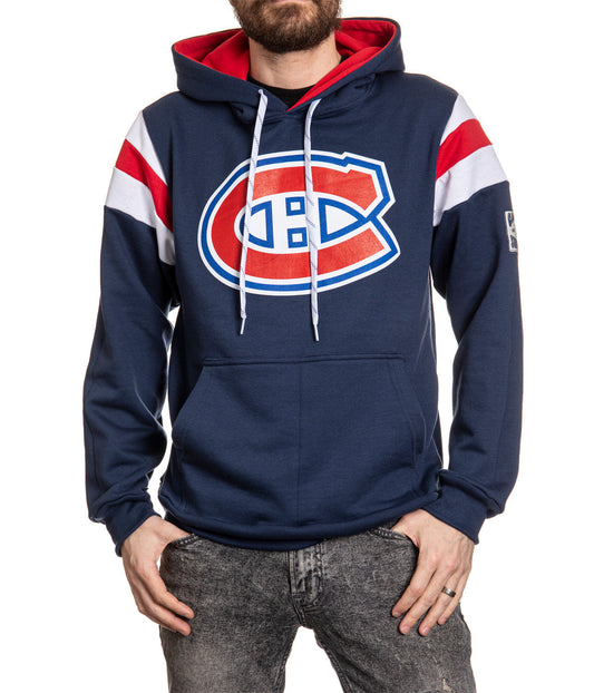 Person wearing a navy blue hoodie with a red and white logo on a white background