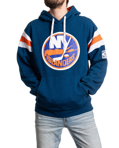 Blue hoodie with Islanders logo worn by a person on a white background
