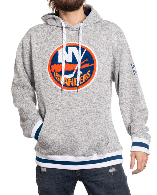 Gray hoodie with Islanders logo worn by a person on a white background