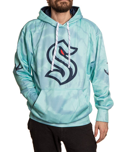 Light blue hoodie with a logo worn by a person on a white background