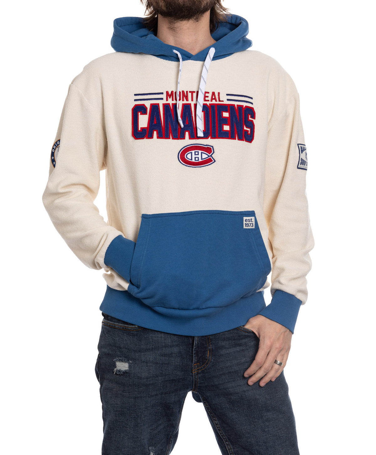 Person wearing a Montreal Canadiens hoodie with blue and white design