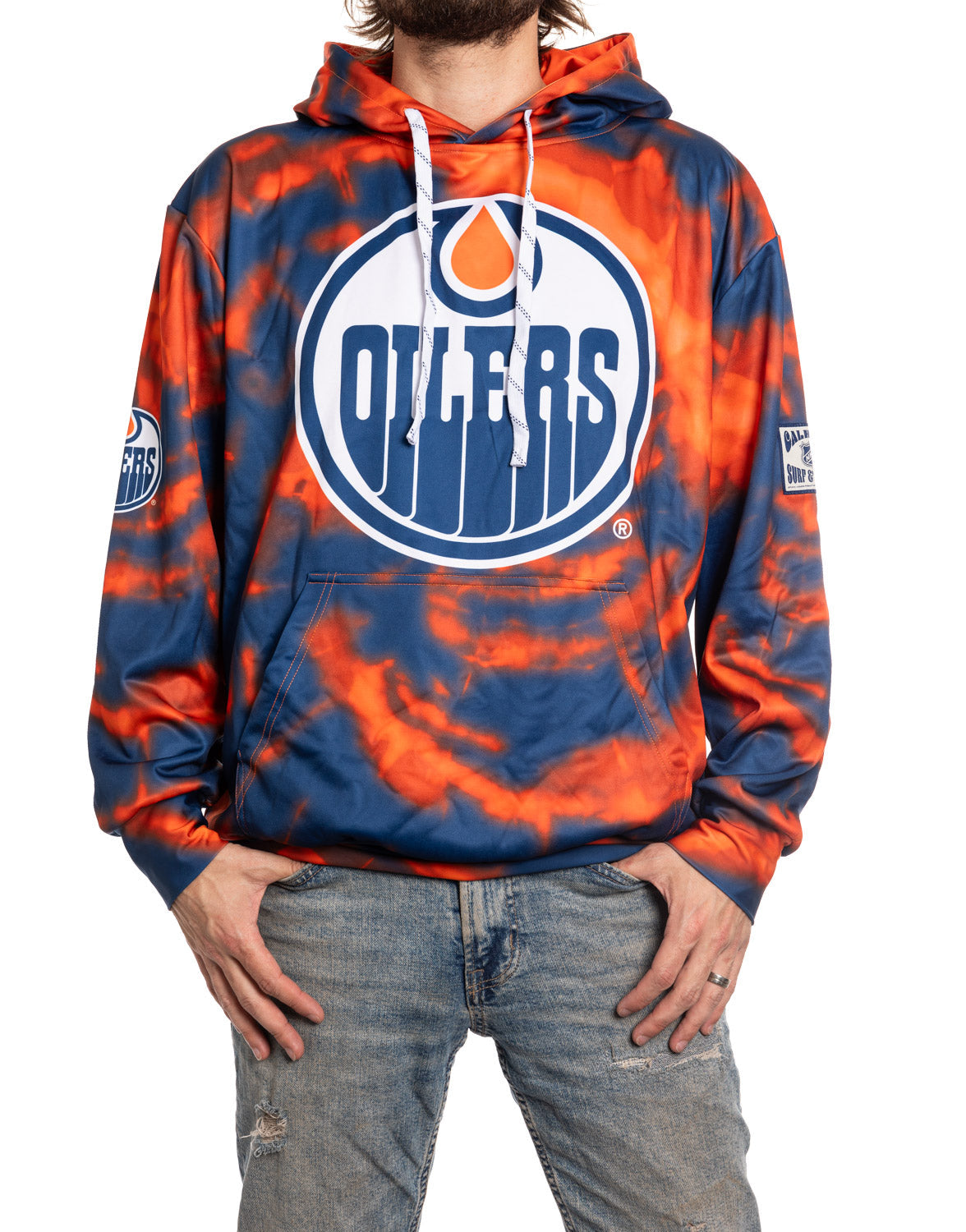 Person wearing an Edmonton Oilers tie-dye hoodie on a white background