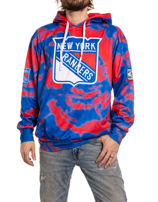 Person wearing a New York Rangers hoodie with tie-dye design on a white background