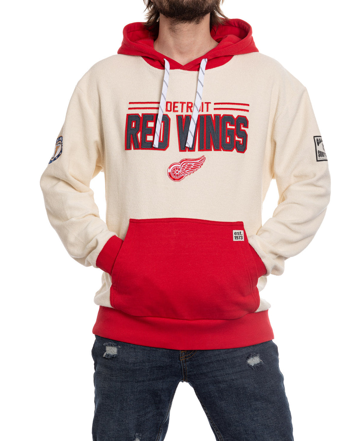 Person wearing a Detroit Red Wings hoodie on a white background