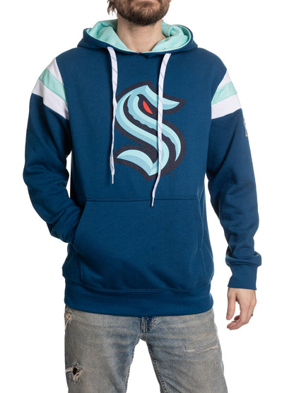 Blue hoodie with a logo worn by a person on a white background