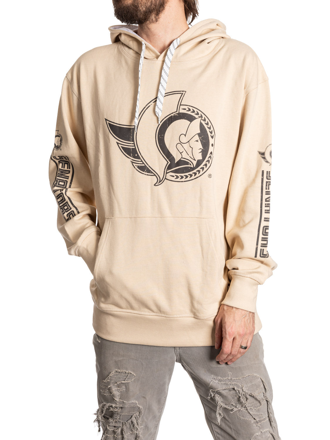 Beige hoodie with a logo worn by a person on a white background