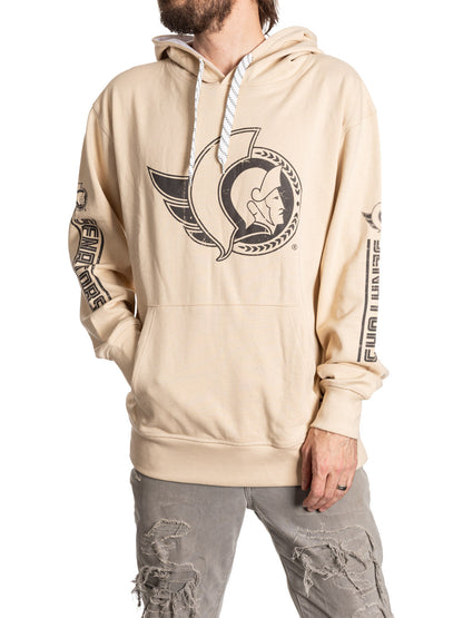 Beige hoodie with a logo worn by a person on a white background