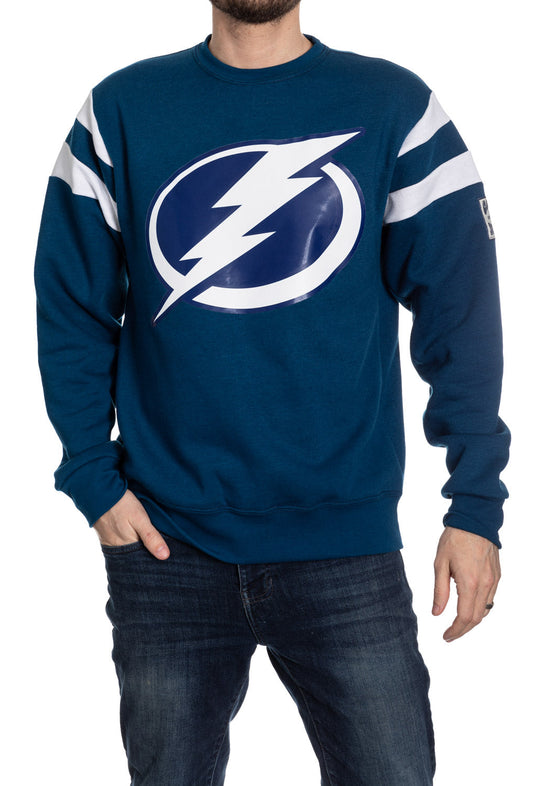 Blue sweatshirt with a logo worn by a person on a white background