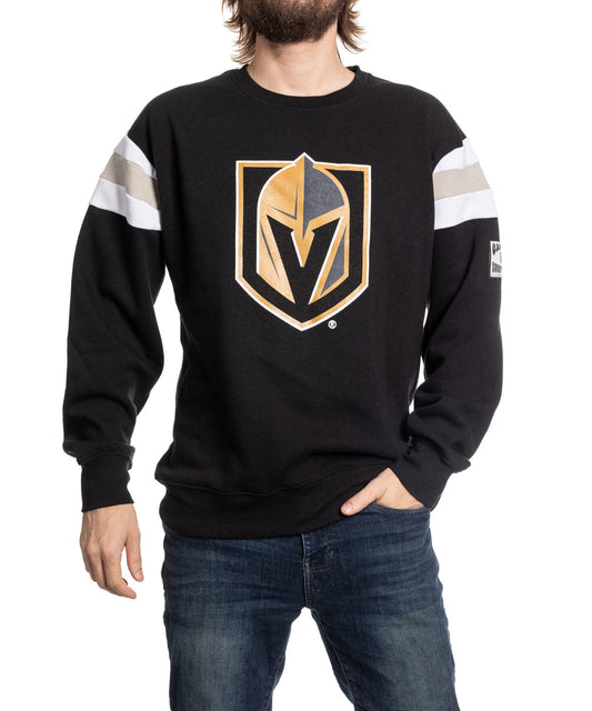 Person wearing a black sweatshirt with a sports team logo on a white background