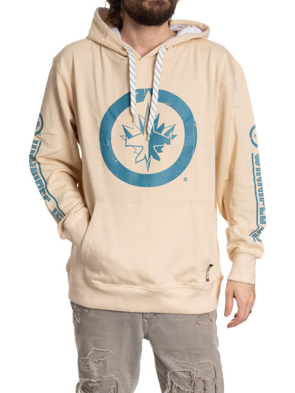 Beige hoodie with blue logo and designs on sleeves, worn by a person.