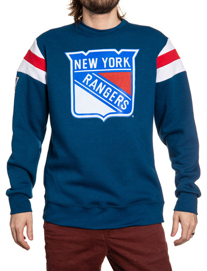Blue New York Rangers sweatshirt worn by a person on a white background